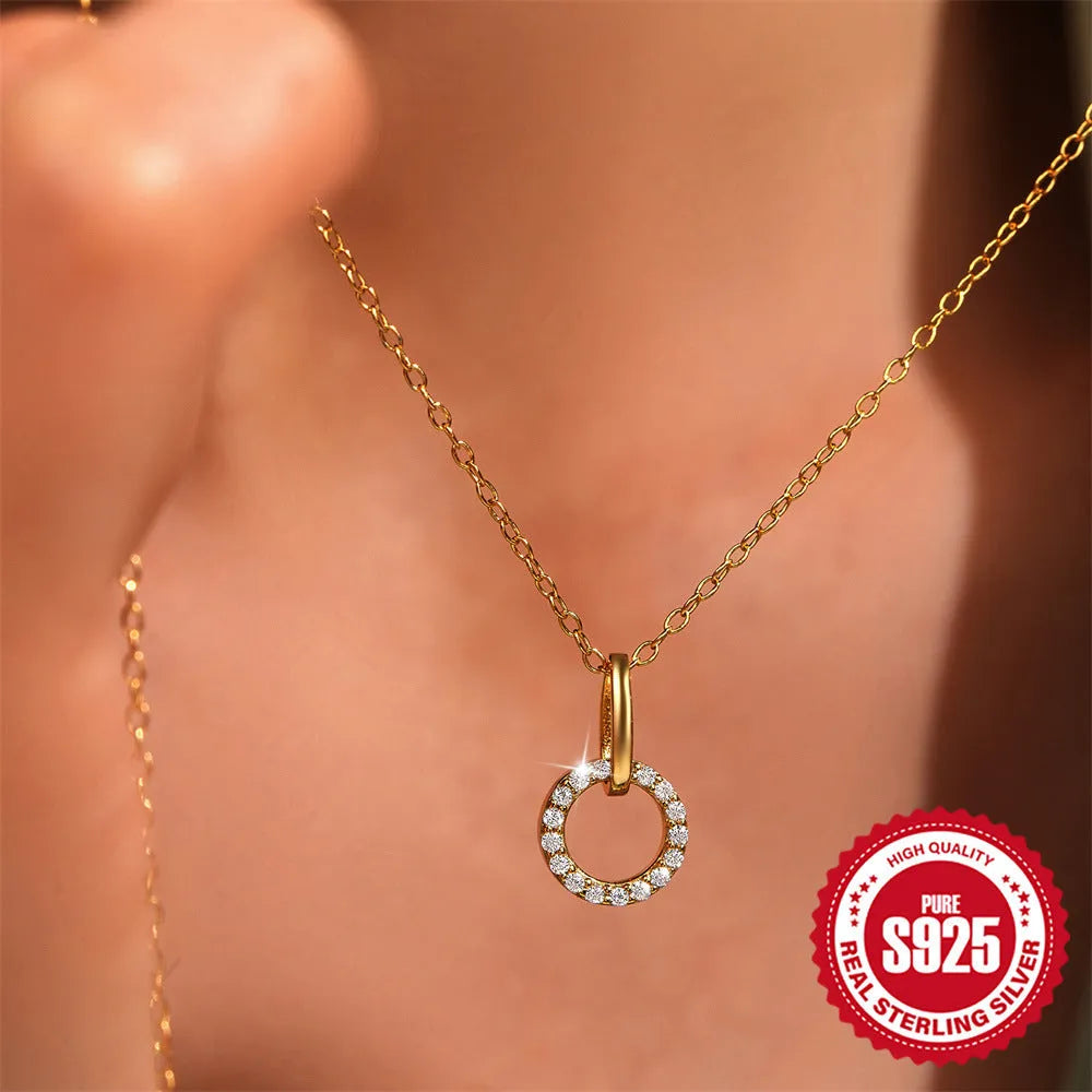 Gold tone S925 sterling silver clavicle chain with geometric interlocking zircon pendant.