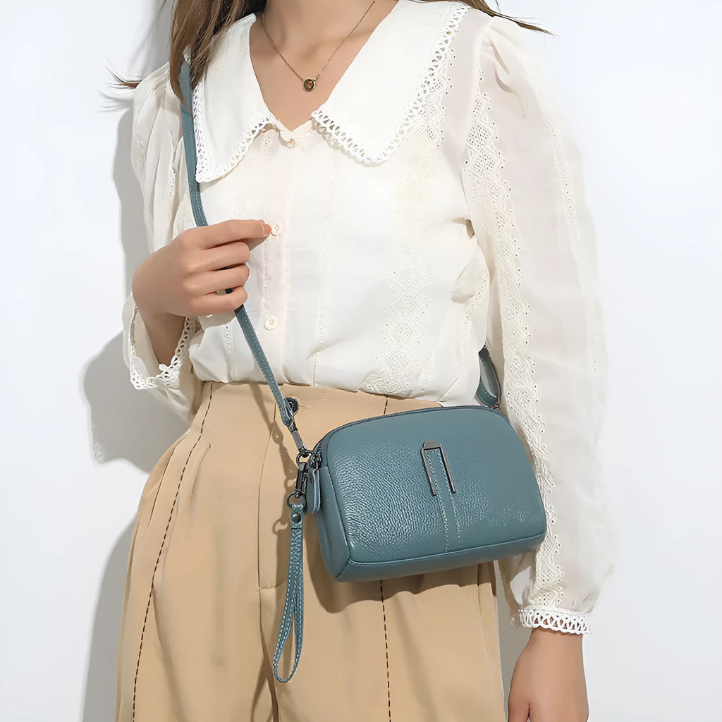 Women's genuine leather square shoulder bag in black with first layer cowhide construction measuring 19x13x6cm