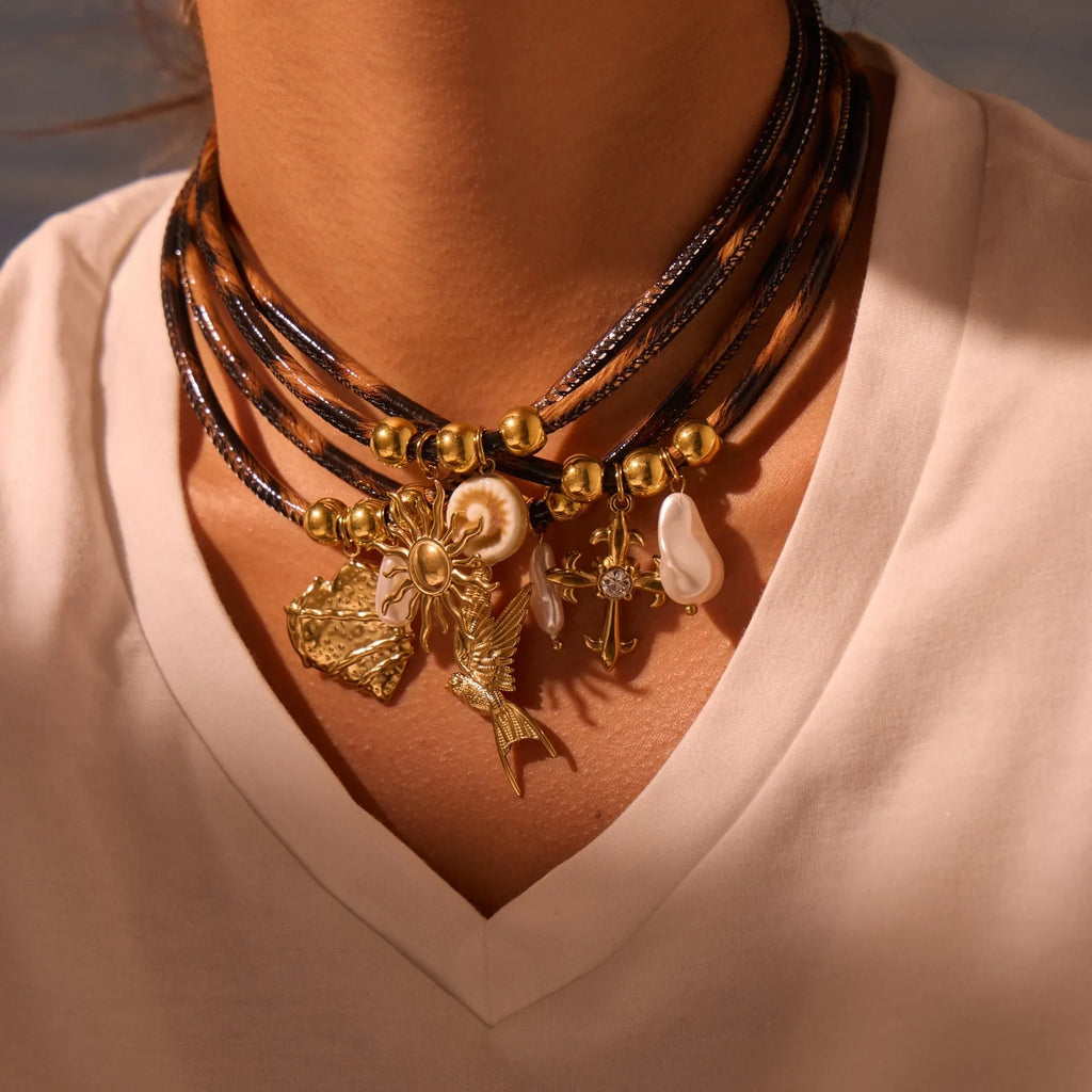 Geometric leopard pattern pendant necklace for women on an adjustable stainless steel chain with 18K gold plating.