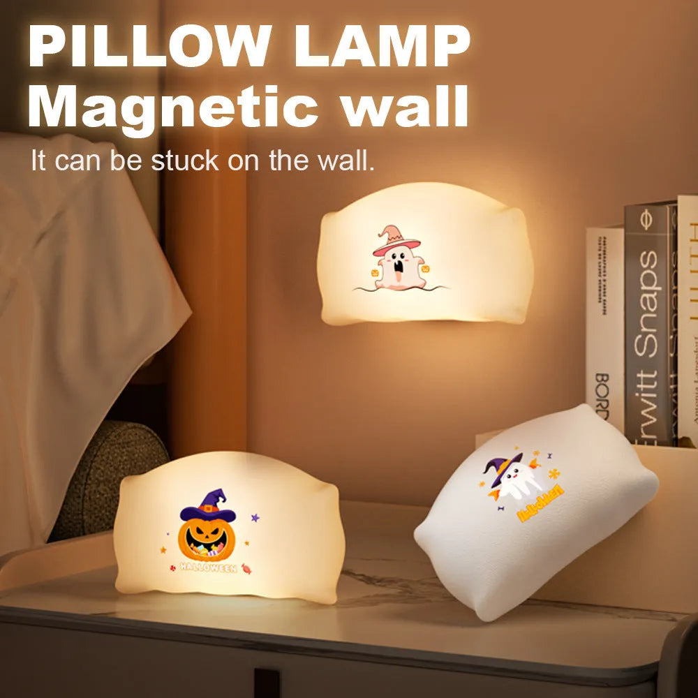 Cartoon ghost doll USB-C rechargeable table lamp in magic ghost or pumpkin ghost colour on a bedside table.