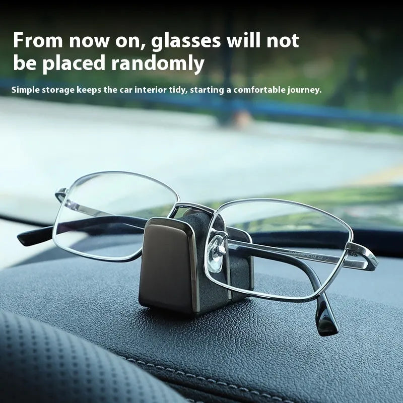 Zinc alloy and leather sunglasses clip holder for car dashboard in black, grey, green, or red.
