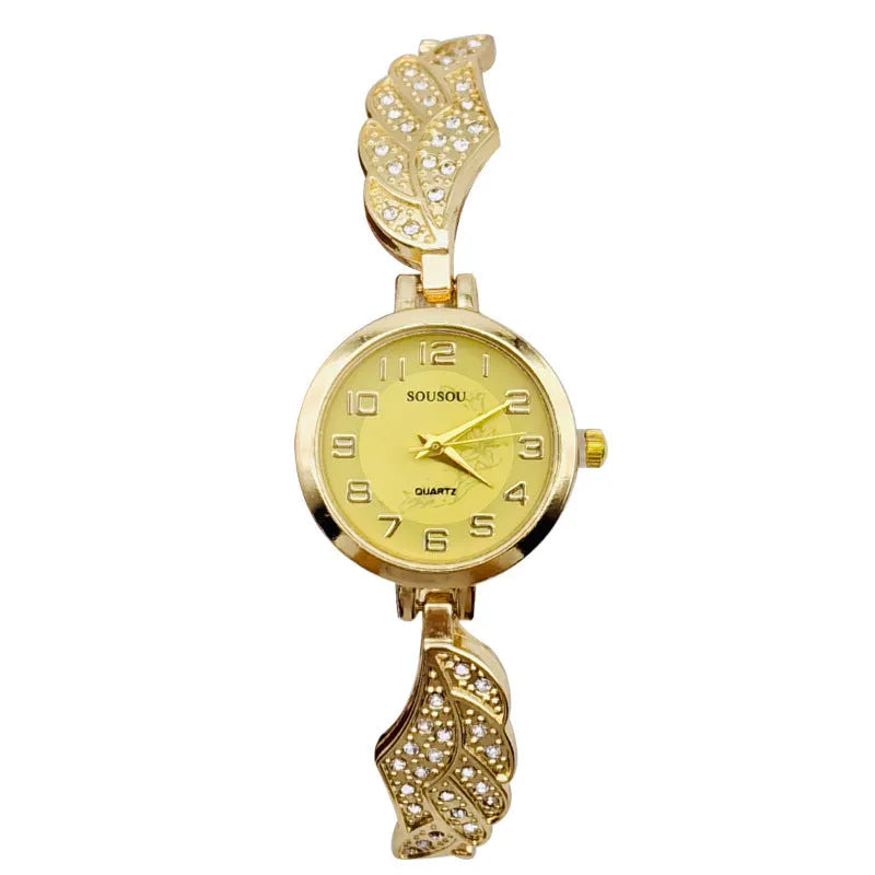 Stainless steel women's watch with round dial on wrist showing gold surface colour