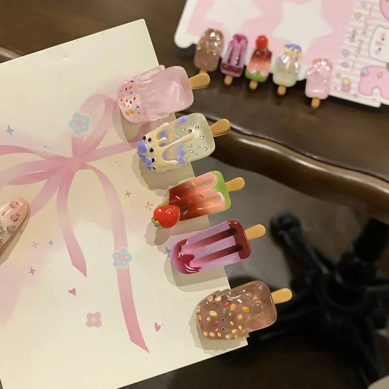 Close-up of a resin hair clip with a cartoon ice cream design in a choice of five colours.