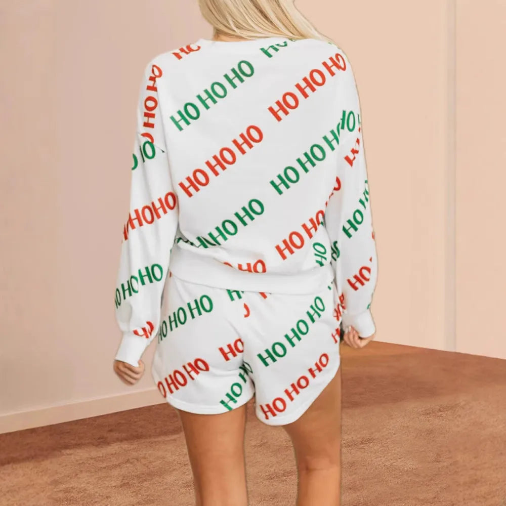 White women's two-piece suit with black letters print on the long-sleeved top and trousers.