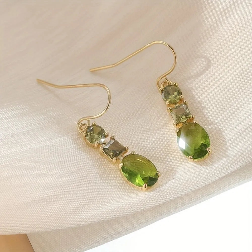 Green geometric quadrilateral copper earrings in a retro Bohemian unisex style.