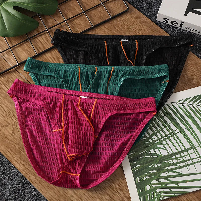 Men's low waist ice silk lace briefs in solid colours on a white background.