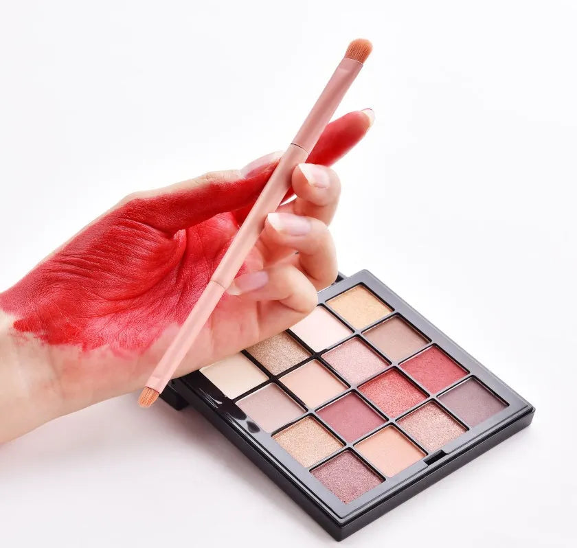 10 professional makeup brushes with wooden handles, including powder, foundation, and double-ended detail brushes.