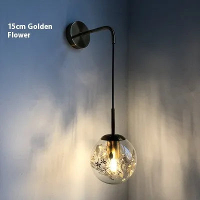 Glass wall lamp with floral pattern in choice of golden or silver finish