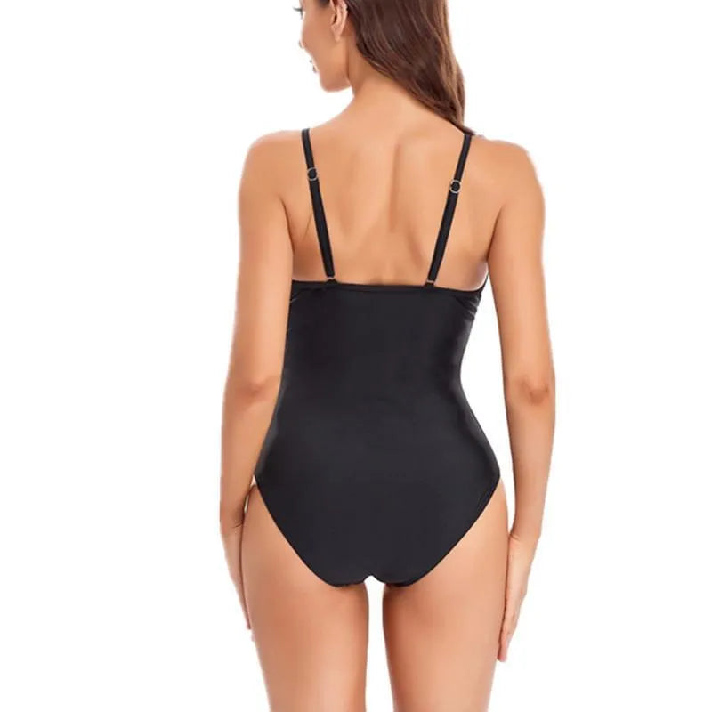 Solid colour backless one-piece swimsuit on a hanger, shown in black and blue options.