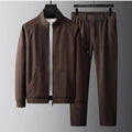 Stand collar casual sports suit comprising a coat and trousers in a slim fit, shown in coffee colour.