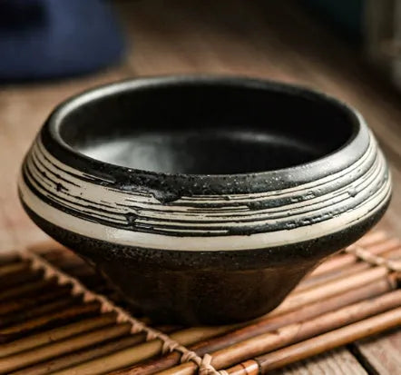Tall porcelain Japanese soup bowl with stone conch shape and underglaze retro pattern.