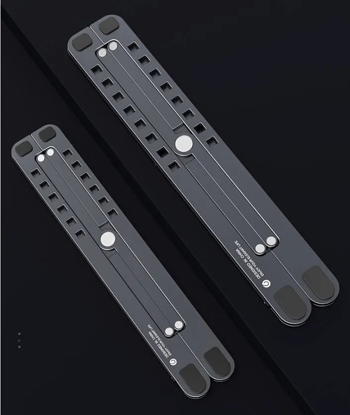 Aluminium laptop stand folded flat next to an open laptop showing adjustable height settings.