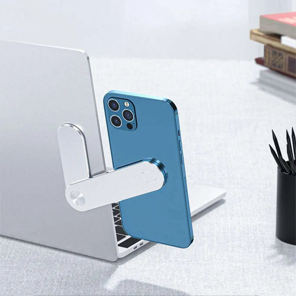 Black aluminium laptop phone holder mounted on computer monitor with smartphone attached