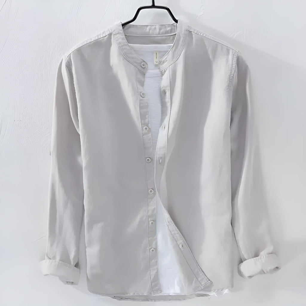 Man wearing a loose fit light blue long sleeve linen casual shirt