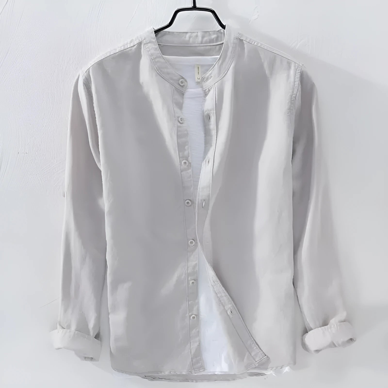 Man wearing a loose fit light blue long sleeve linen casual shirt