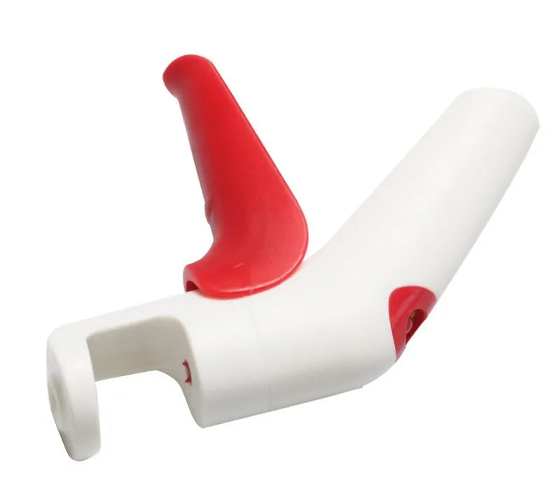 A manual cherry kernel remover kitchen tool with a handle for pitting cherries