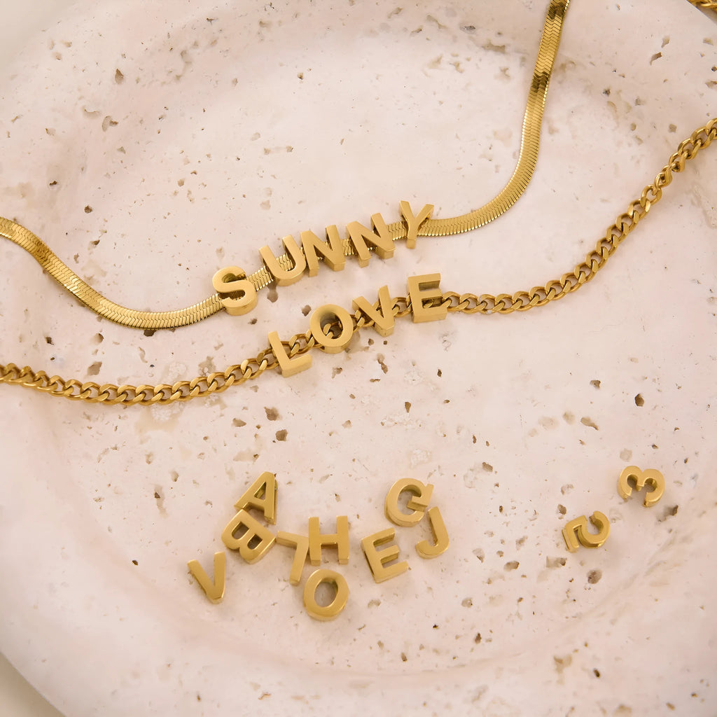 Gold plated titanium steel necklace with the letter A pendant on a 40.5cm chain.
