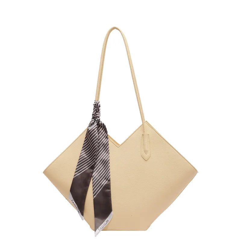 Women's large black PU leather shoulder bag with square shape showing exterior pocket and adjustable handle