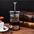 Glass and stainless steel manual coffee maker measuring 10cm wide, 8cm deep, 17cm tall with 350ml capacity.