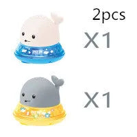 Electric whale bath toy spraying water with flashing LED lights in baby bath