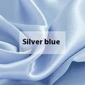 Double-sided solid colour silk duvet cover shown in Lotus Pink on a bed