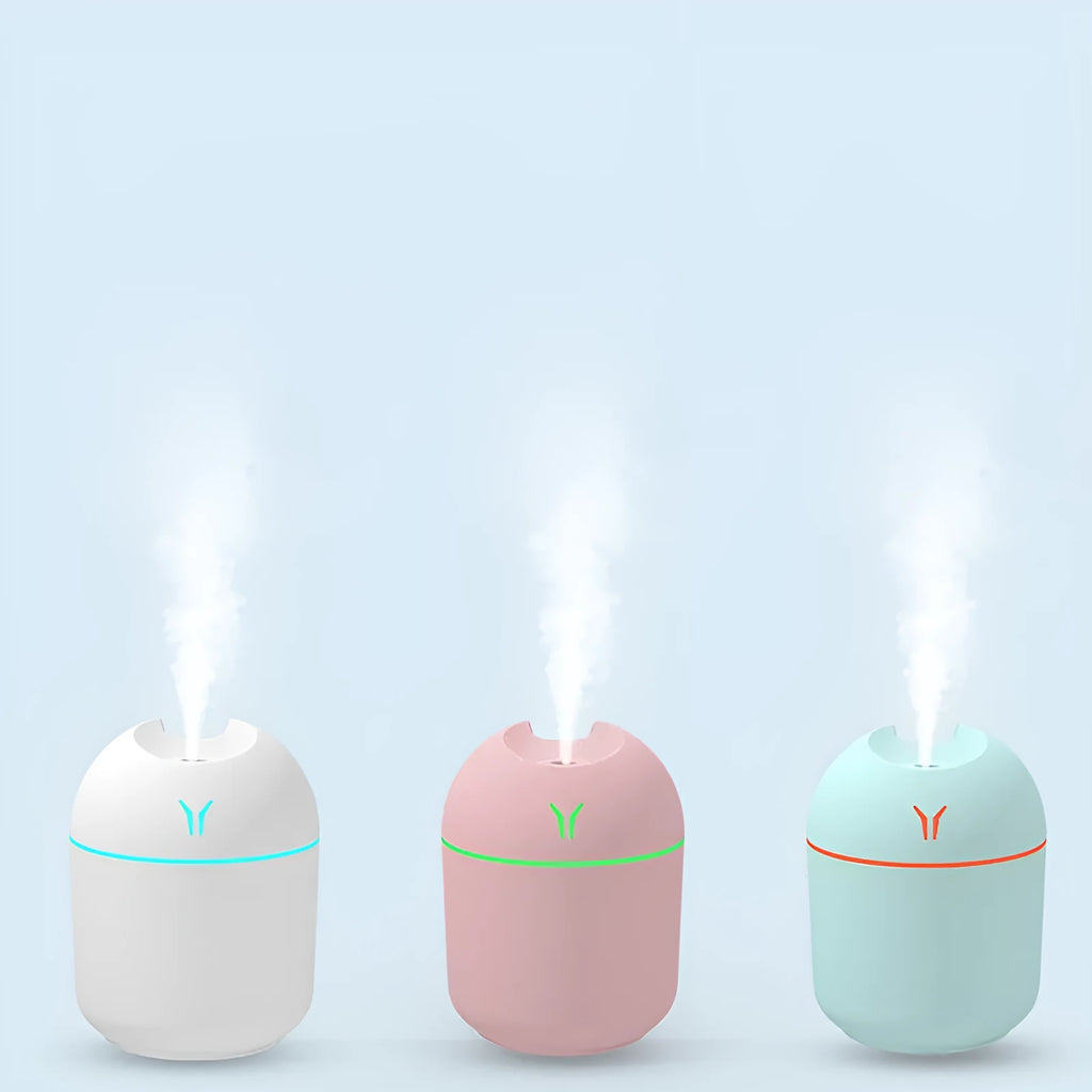 Round desktop humidifier with USB cable in ivory white, sky blue, or pink colour options