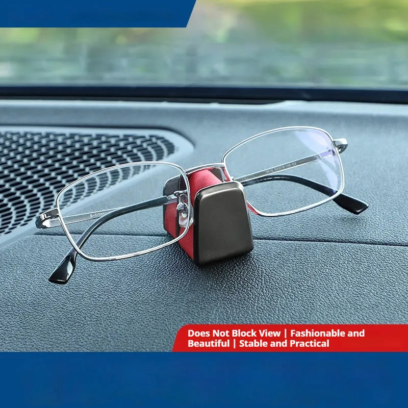 Zinc alloy and leather sunglasses clip holder for car dashboard in black, grey, green, or red.