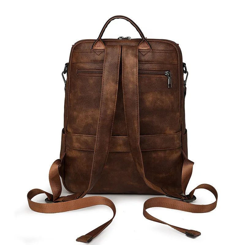 Retro college student backpack in PU leather with curved shoulder straps and solid colour options