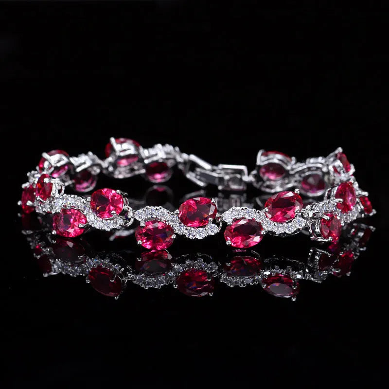 Copper gold plated women's bracelet with white gold colour finish and inlaid AAA zircon stones on a geometric band.