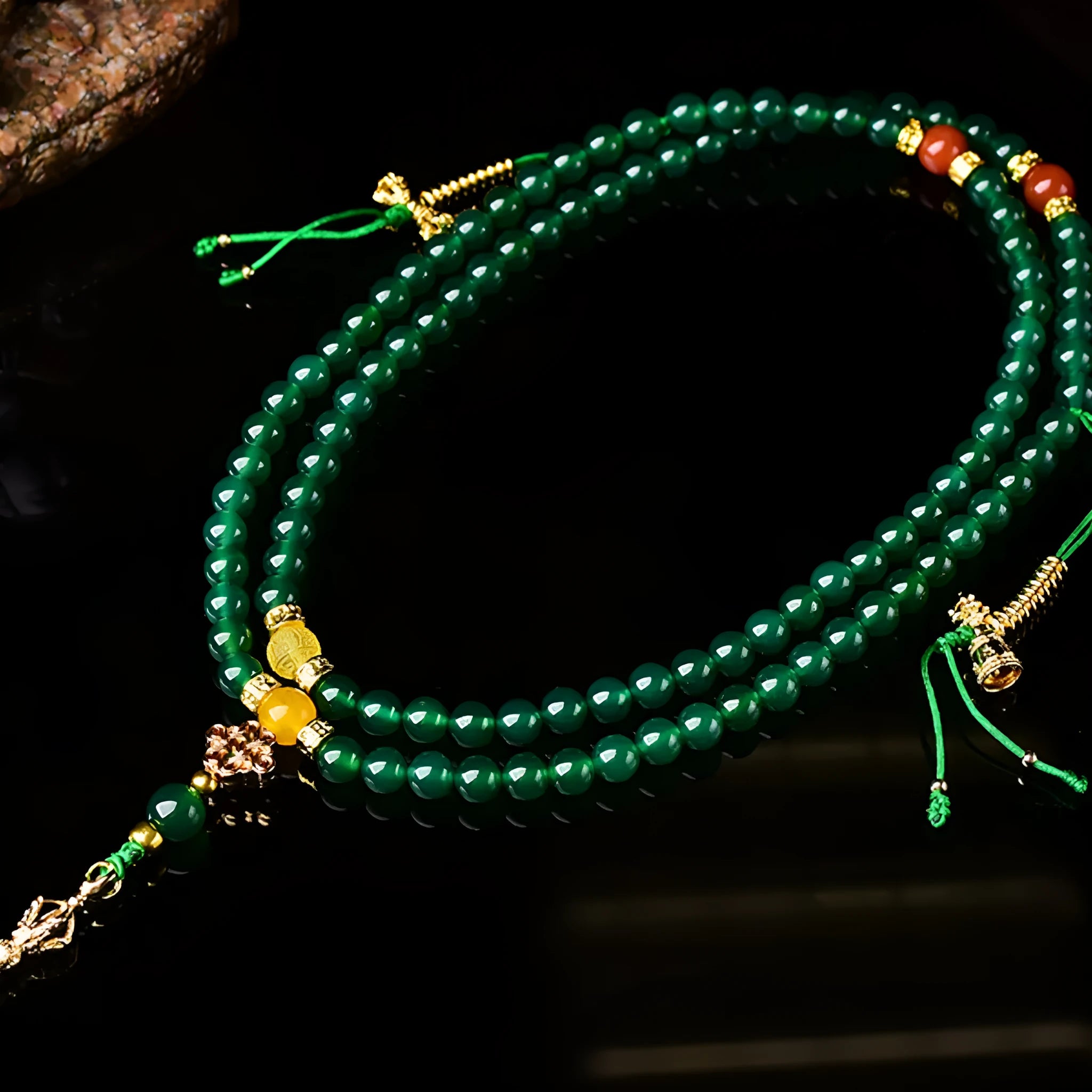 Handcrafted multi-circle green agate bracelet with natural stone beads on a wrist.