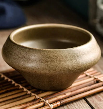 Tall porcelain Japanese soup bowl with stone conch shape and underglaze retro pattern.