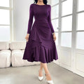 Purple women's long sleeve dress with round neck, mid waist, and ruffle details on a hanger.
