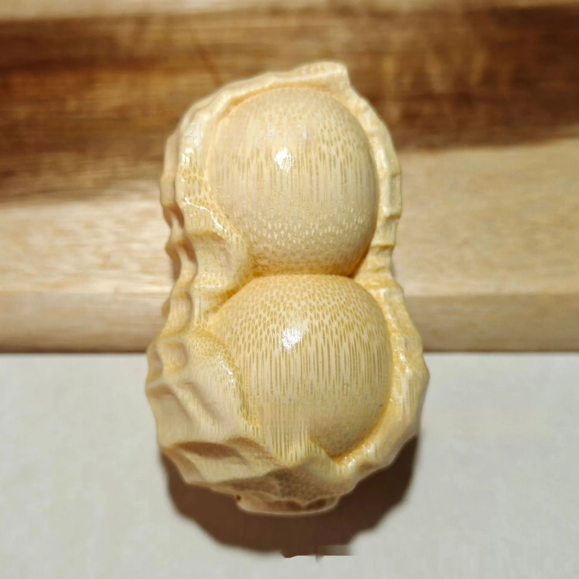 Solid bamboo carving peanut ornament with modern simplicity style and 'May Good Things Happen' message