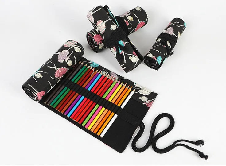 Canvas pencil case roll with ballet girl print, shown unrolled to display multiple pencil pockets.