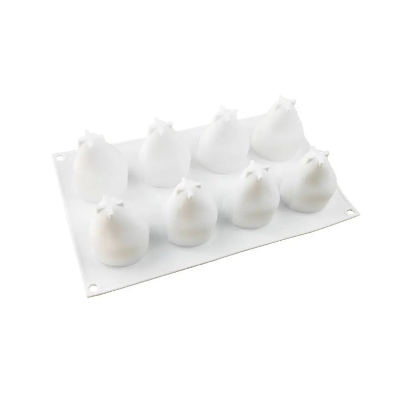 Flexible silicone baking mould with six cavities shaped like pineapple, pine cone, and pear fruit.