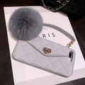 Plush textured hairball iPhone back cover case in a dark green grid pattern, showing the tactile surface.