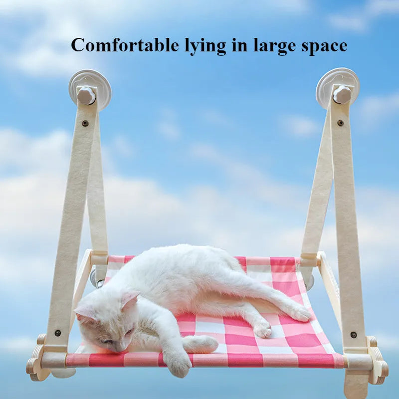 Wooden cat window hammock with linen fabric attached to window using suction cups