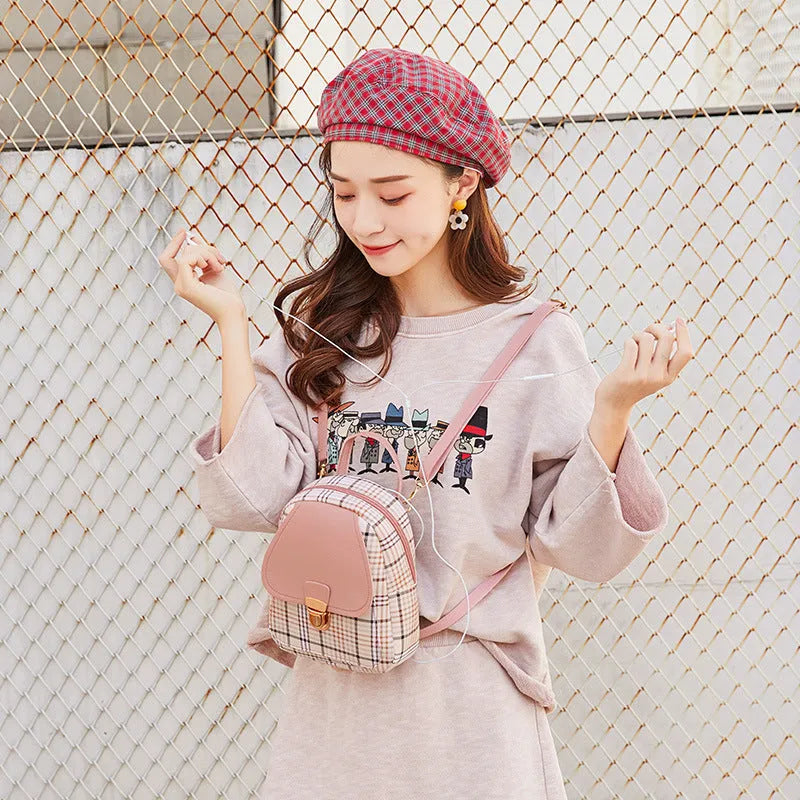 A one shoulder diagonal phone bag in PU fabric, shown in one of five colour options.