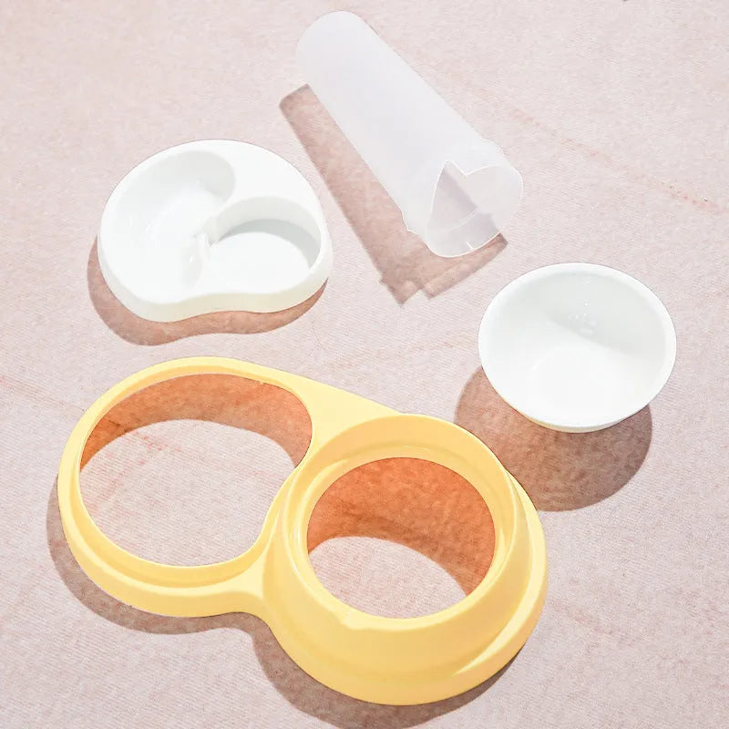 Grey pet double feeding bowl with raised design and non-slip base showing food and water compartments