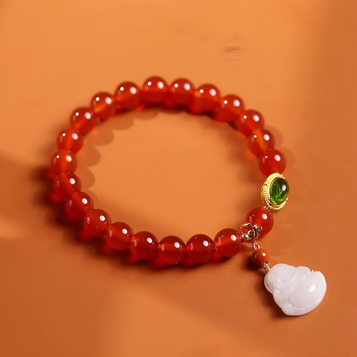 Handcrafted red agate and amber bracelet with geometric design and gold Maitreya Buddha charm
