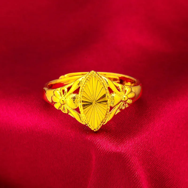Gold-coloured geometric brass ring with textured design elements for women