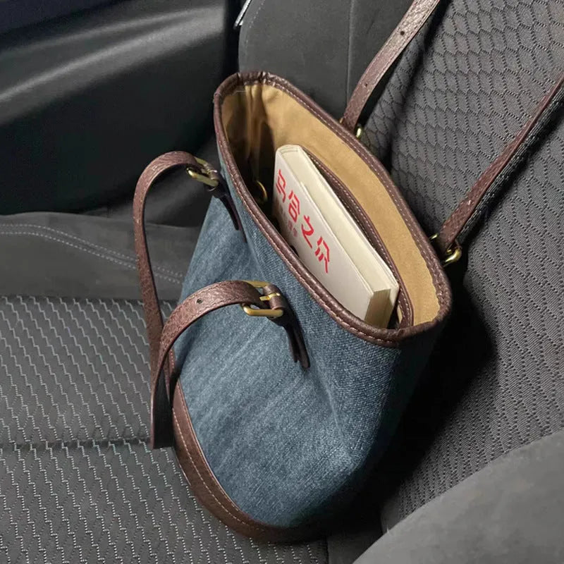 Denim colour patchwork handbag with retro bucket design showing 23cm width, 27cm height dimensions
