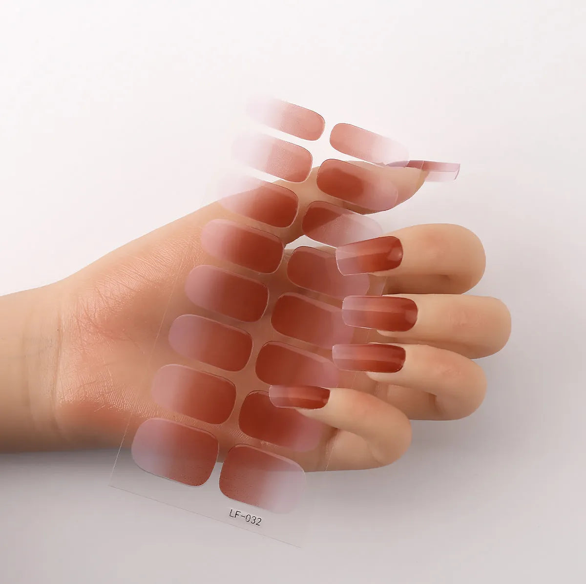 Full coverage nail art stickers sheet with 16 designs including cross, rose, tulip, and cartoon patterns.