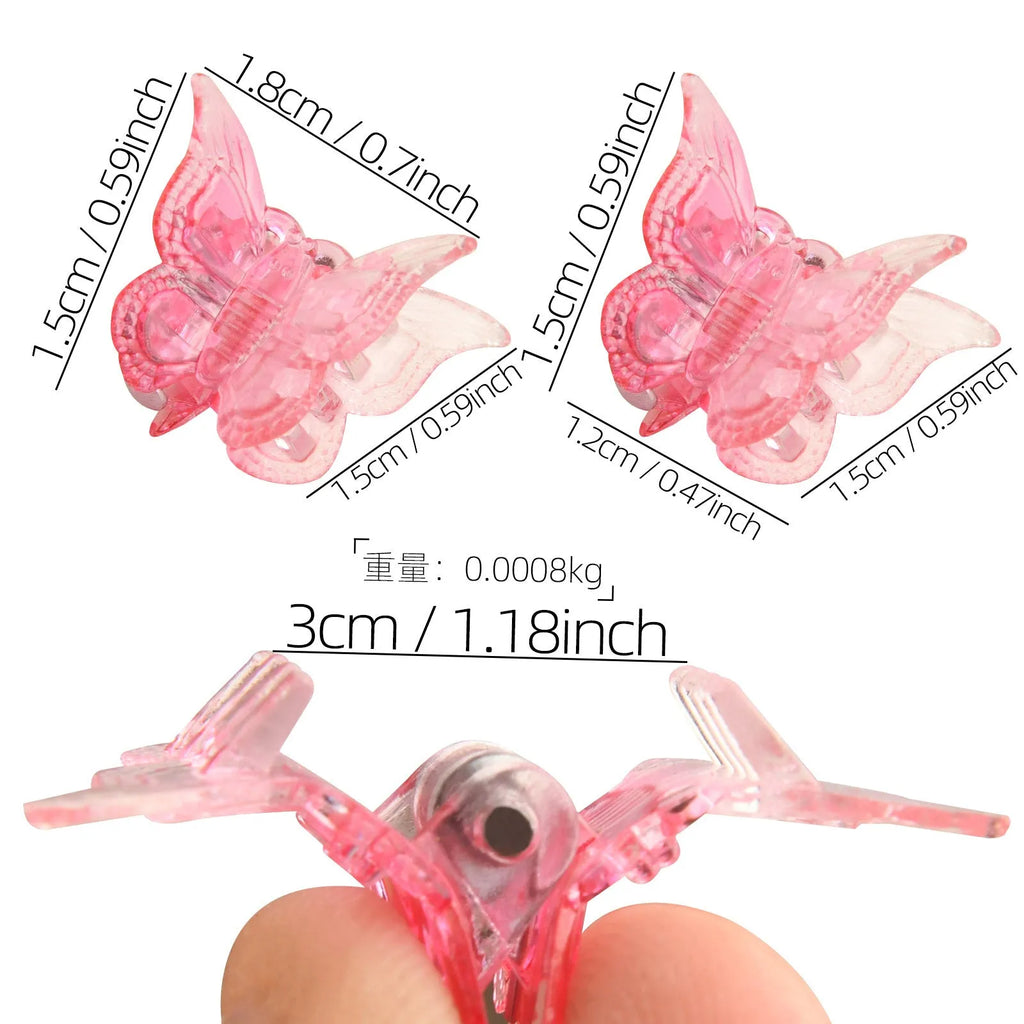 Assortment of 50 small glitter butterfly hair claw clips in 14 different colours on a white background.