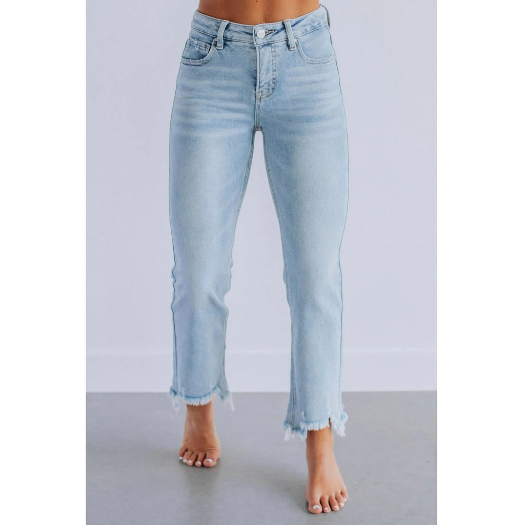Women's solid colour denim jeans with a hand-worn finish in dark blue and light blue options.