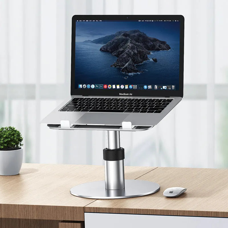 Silver aluminium car laptop stand with adjustable height and 360-degree rotating base on a car seat.