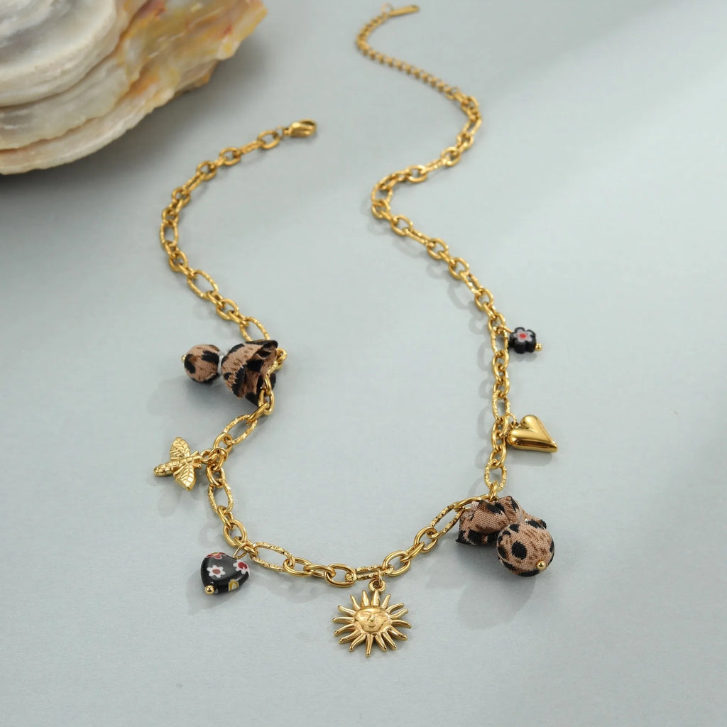 Women's stainless steel necklace with geometric leopard, heart, and flower pendant designs on 41-50cm chain