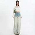 Women's gradient blue straight-leg denim trousers with wide-leg cut on hanger