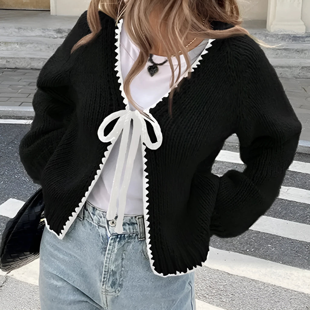 Grey lace-up cardigan with crocheted flower details and loose long sleeves