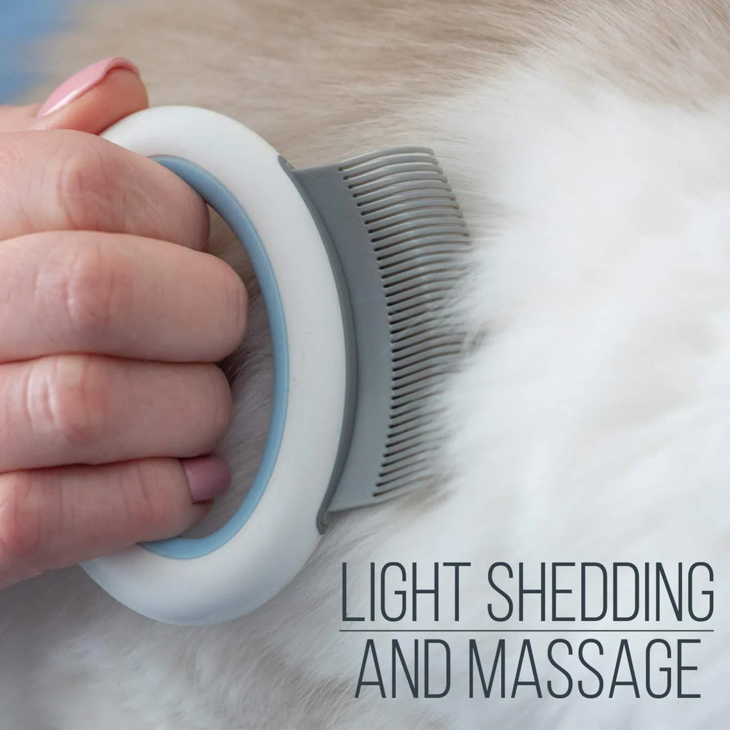 Blue pet grooming comb for cats and dogs on a white background